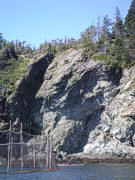 This is a view from the water of a herring wier, a kayaker, and if you look closely on the top of the cliff face, our campsite. Quite an impressive location. 